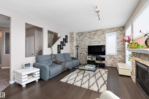 1105 Klarvatten Cove, Edmonton, AB - Indoor Photo Showing Living Room With Fireplace