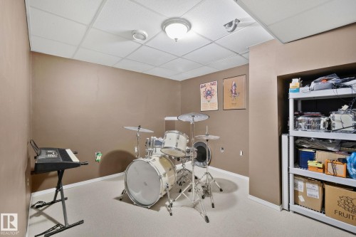 Game room with a drop ceiling and carpet floors - 3 1820 56 Street, Edmonton, AB - Indoor