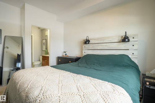 Bedroom with ensuite bath - 411 1619 James Mowatt Trail, Edmonton, AB - Indoor Photo Showing Bedroom