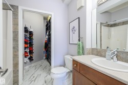 Full bath featuring vanity, light marble finish floors, and tub / shower combination - 