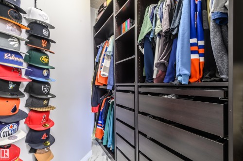 View of walk in closet - 411 1619 James Mowatt Trail, Edmonton, AB - Indoor With Storage