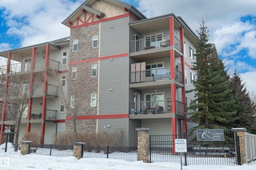 Snow covered property with a view of apartment building / complex - 411 1619 James Mowatt Trail, Edmonton, AB - Outdoor With Facade