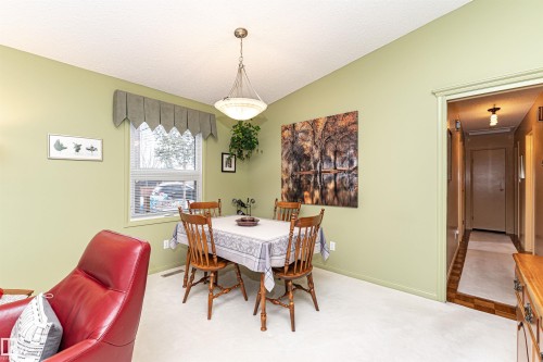 Dining room with baseboards and carpet flooring - 2112 67 Street Nw, Edmonton, AB - Indoor Photo Showing Dining Room