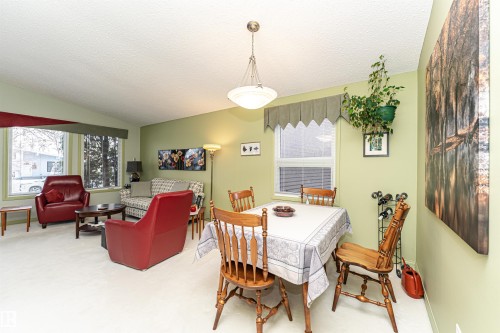 Carpeted dining space with baseboards - 2112 67 Street Nw, Edmonton, AB - Indoor Photo Showing Other Room