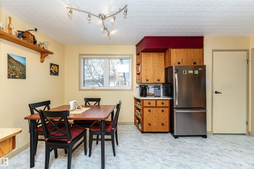 Dining room with rail lighting and baseboards - 2112 67 Street Nw, Edmonton, AB - Indoor