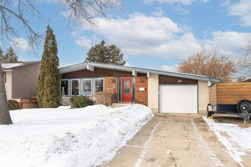 View of front of home featuring brick siding and an attached garage - 2112 67 Street Nw, Edmonton, AB - Outdoor