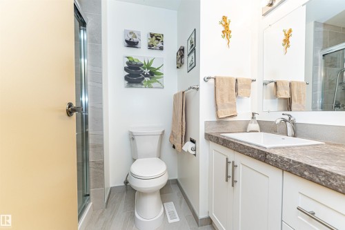 Bathroom featuring vanity and a stall shower - 2112 67 Street Nw, Edmonton, AB - Indoor Photo Showing Bathroom