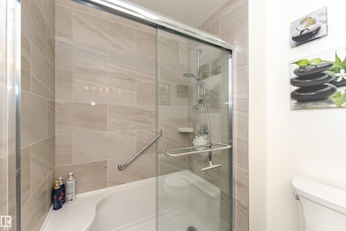 Bathroom with a shower stall and toilet - 2112 67 Street Nw, Edmonton, AB - Indoor Photo Showing Bathroom