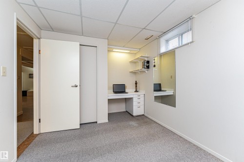 Unfurnished office featuring a drop ceiling and light colored carpet - 2112 67 Street Nw, Edmonton, AB - Indoor Photo Showing Other Room
