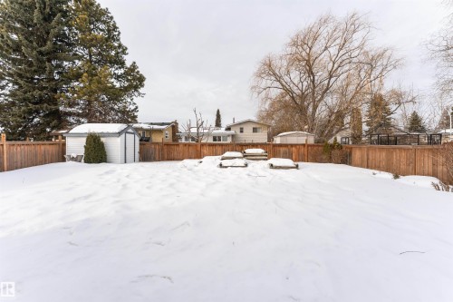 Fenced backyard featuring a storage shed - 2112 67 Street Nw, Edmonton, AB - Outdoor