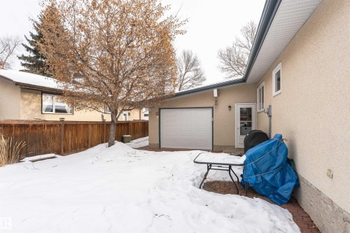 View of yard layered in snow - 2112 67 Street Nw, Edmonton, AB - Outdoor With Exterior