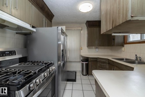 9405 110 Avenue, Edmonton, AB - Indoor Photo Showing Kitchen With Double Sink