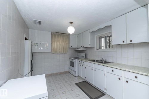 9405 110 Avenue, Edmonton, AB - Indoor Photo Showing Kitchen With Double Sink