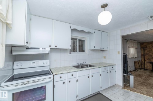 9405 110 Avenue, Edmonton, AB - Indoor Photo Showing Kitchen With Double Sink