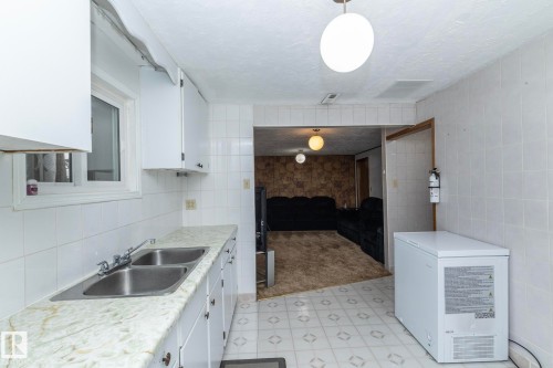 9405 110 Avenue, Edmonton, AB - Indoor Photo Showing Kitchen With Double Sink