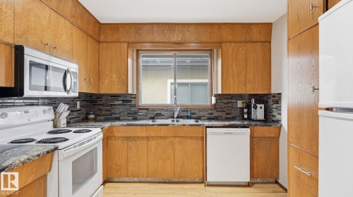 8911 83 Avenue, Edmonton, AB - Indoor Photo Showing Kitchen With Double Sink