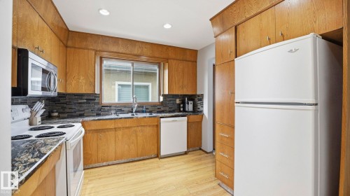 8911 83 Avenue, Edmonton, AB - Indoor Photo Showing Kitchen With Double Sink