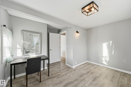 Office with baseboards and light wood-type flooring - 10656 93 Street, Edmonton, AB - Indoor Photo Showing Other Room