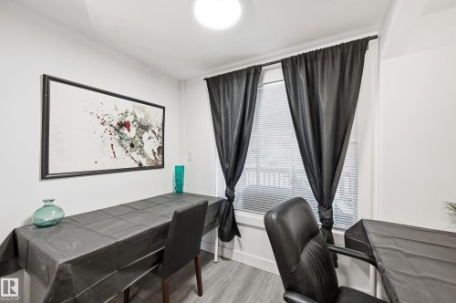 Office featuring light wood-type flooring and baseboards - 10656 93 Street, Edmonton, AB - Indoor