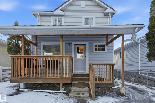 View of snow covered rear of property - 10656 93 Street, Edmonton, AB - Outdoor With Deck Patio Veranda With Exterior