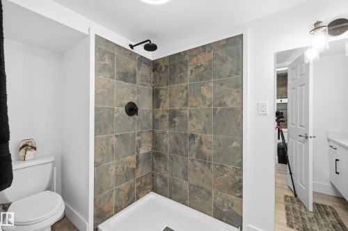 Full bath with tiled shower and vanity - 10656 93 Street, Edmonton, AB - Indoor Photo Showing Bathroom