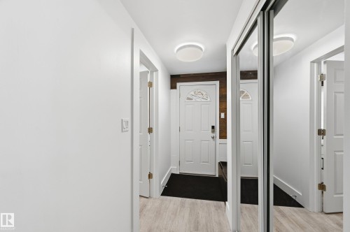 Entryway featuring wood finished floors - 10656 93 Street, Edmonton, AB - Indoor Photo Showing Other Room