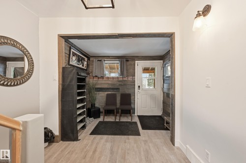 Foyer entrance featuring light wood-type flooring and baseboards - 10656 93 Street, Edmonton, AB - Indoor Photo Showing Other Room