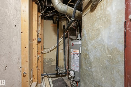 Utility room with water heater - 10656 93 Street, Edmonton, AB - Indoor Photo Showing Basement