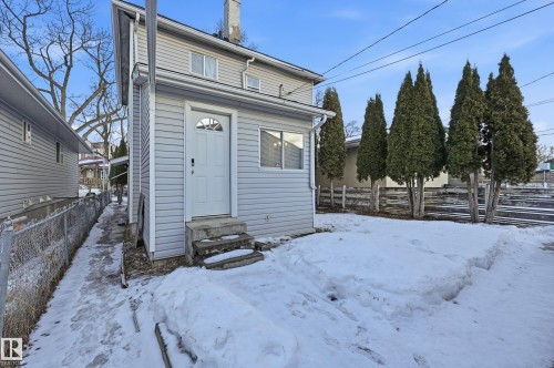 Snow covered rear of property with entry steps - 10656 93 Street, Edmonton, AB - Outdoor