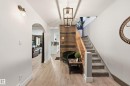 Staircase featuring arched walkways and wood finished floors - 10656 93 Street, Edmonton, AB  - Indoor Photo Showing Other Room 