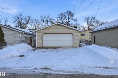 Snow covered garage featuring a detached garage - 10656 93 Street, Edmonton, AB - Outdoor