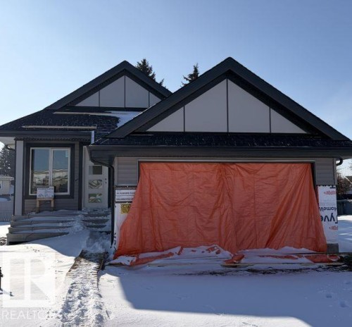 View of front of property featuring an attached garage - 39 Elsinore Place, Edmonton, AB - Outdoor