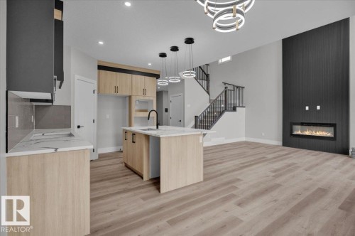 8419 Mayday Link, Edmonton, AB - Indoor Photo Showing Kitchen With Fireplace