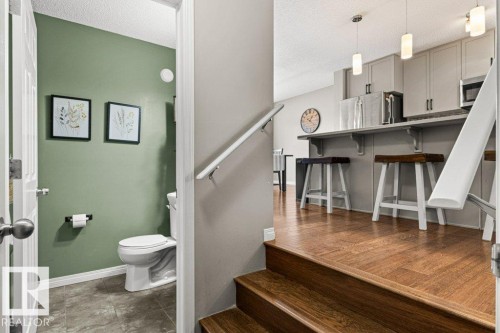 Stairway featuring a textured ceiling - 3351 Orchards Link, Edmonton, AB - Indoor