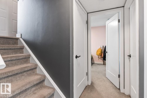 Stairs featuring carpet floors and baseboards - 6411 180 Street, Edmonton, AB - Indoor Photo Showing Other Room