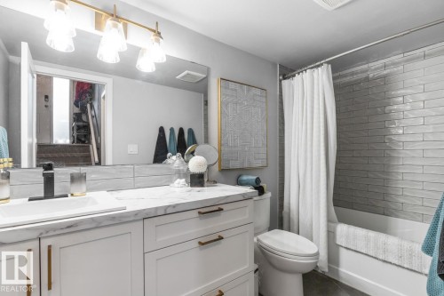 Full bath featuring shower / tub combo and vanity - 6411 180 Street, Edmonton, AB - Indoor Photo Showing Bathroom