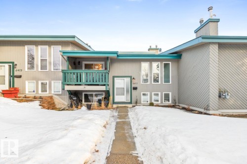 View of front of home featuring a chimney and a balcony - 6411 180 Street, Edmonton, AB - Outdoor With Balcony With Facade