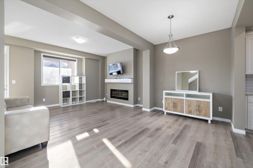 18 2072 Wonnacott Way, Edmonton, AB - Indoor Photo Showing Living Room With Fireplace