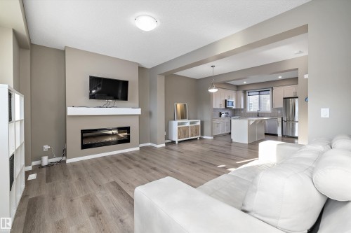 18 2072 Wonnacott Way, Edmonton, AB - Indoor Photo Showing Living Room With Fireplace