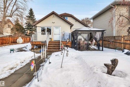 Snow covered back of property with a fenced backyard and a gazebo - 11432 71 Street, Edmonton, AB - Outdoor