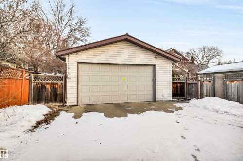 Snow covered garage featuring a garage - 11432 71 Street, Edmonton, AB - Outdoor