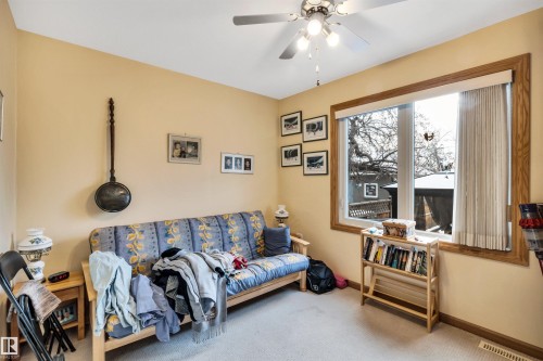 Living room featuring carpet and ceiling fan - 11432 71 Street, Edmonton, AB - Indoor