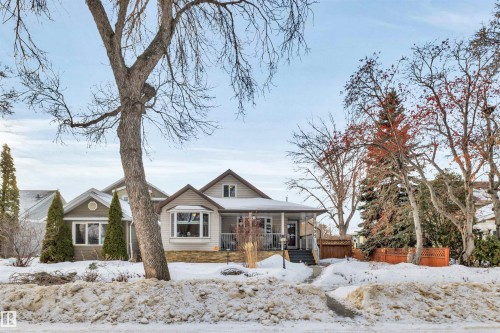 View of front of property with a porch - 11432 71 Street, Edmonton, AB - Outdoor With Facade