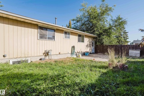 Back of property with a patio and board and batten siding - Edmonton, AB - Outdoor