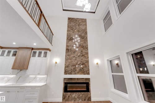 7663 Kimiwan Crescent, Edmonton, AB - Indoor Photo Showing Other Room With Fireplace