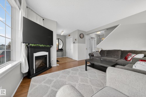 207 River Point(E), Edmonton, AB - Indoor Photo Showing Living Room With Fireplace