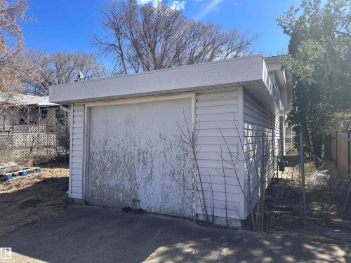 Detached garage with white siding and a flat roofline - 5128 52 Street, Barrhead, AB - Outdoor