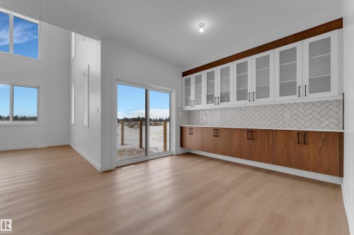 Unfurnished dining area featuring light wood-style flooring and baseboards - 40 Grayson Green, Stony Plain, AB - Indoor Photo Showing Other Room