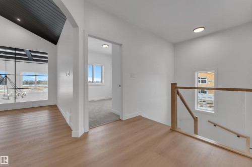 Spare room featuring light wood-style flooring and recessed lighting - 40 Grayson Green, Stony Plain, AB - Indoor Photo Showing Other Room
