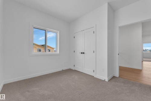 Unfurnished bedroom featuring carpet and a closet - 40 Grayson Green, Stony Plain, AB - Indoor Photo Showing Other Room